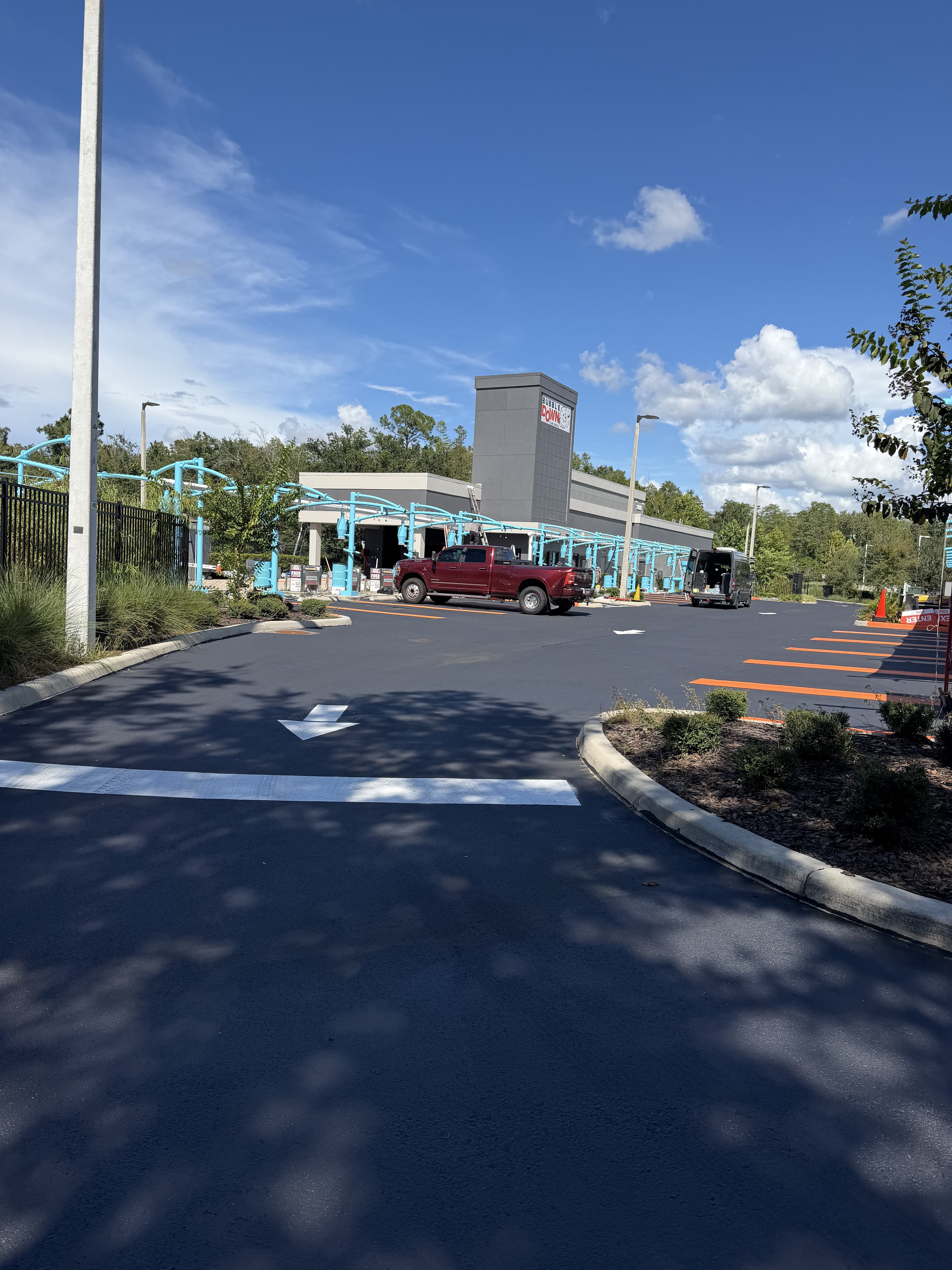 Fresh directional arrows and striping on a car wash lot