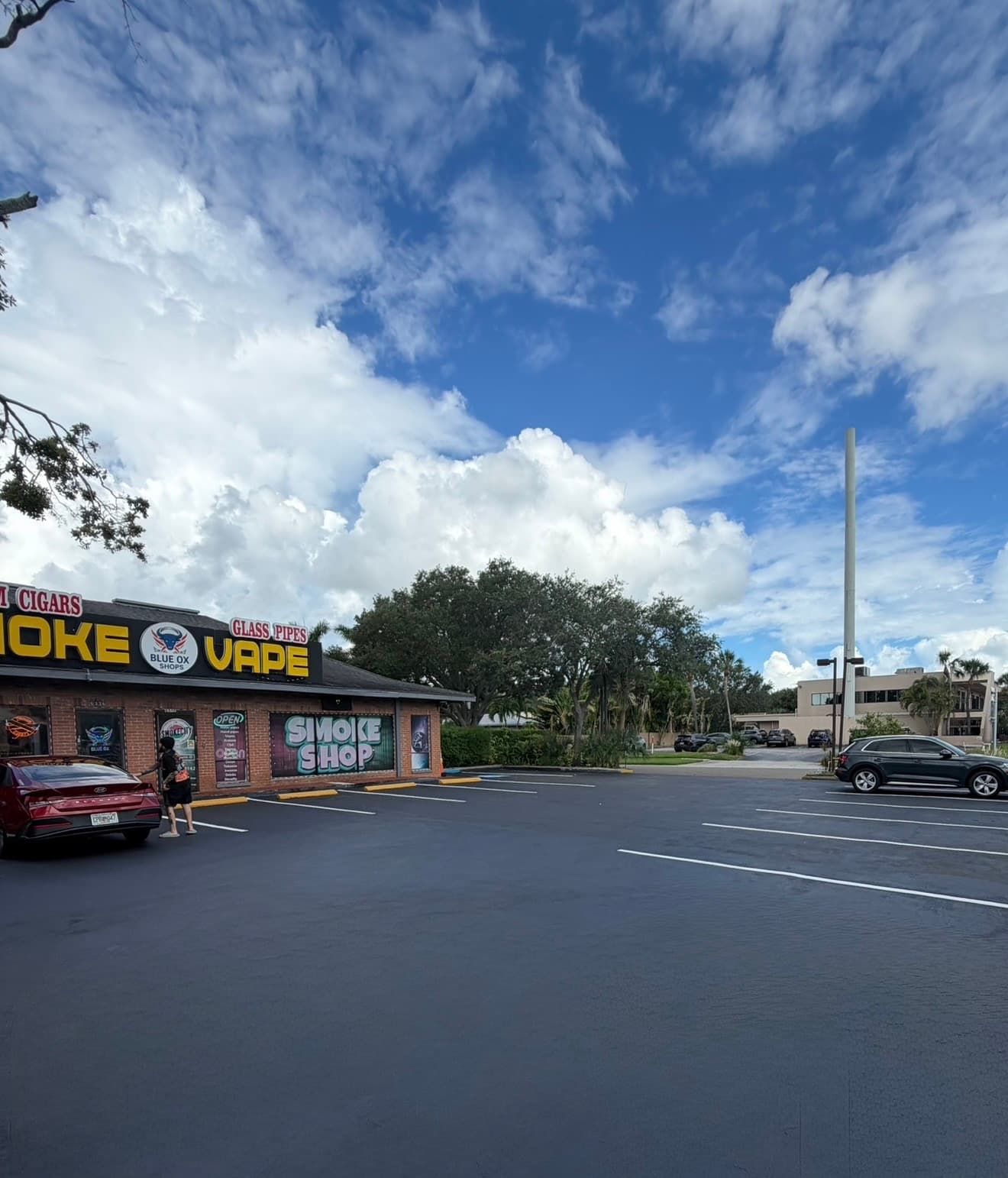 Freshly sealcoated and restriped smoke shop parking lot